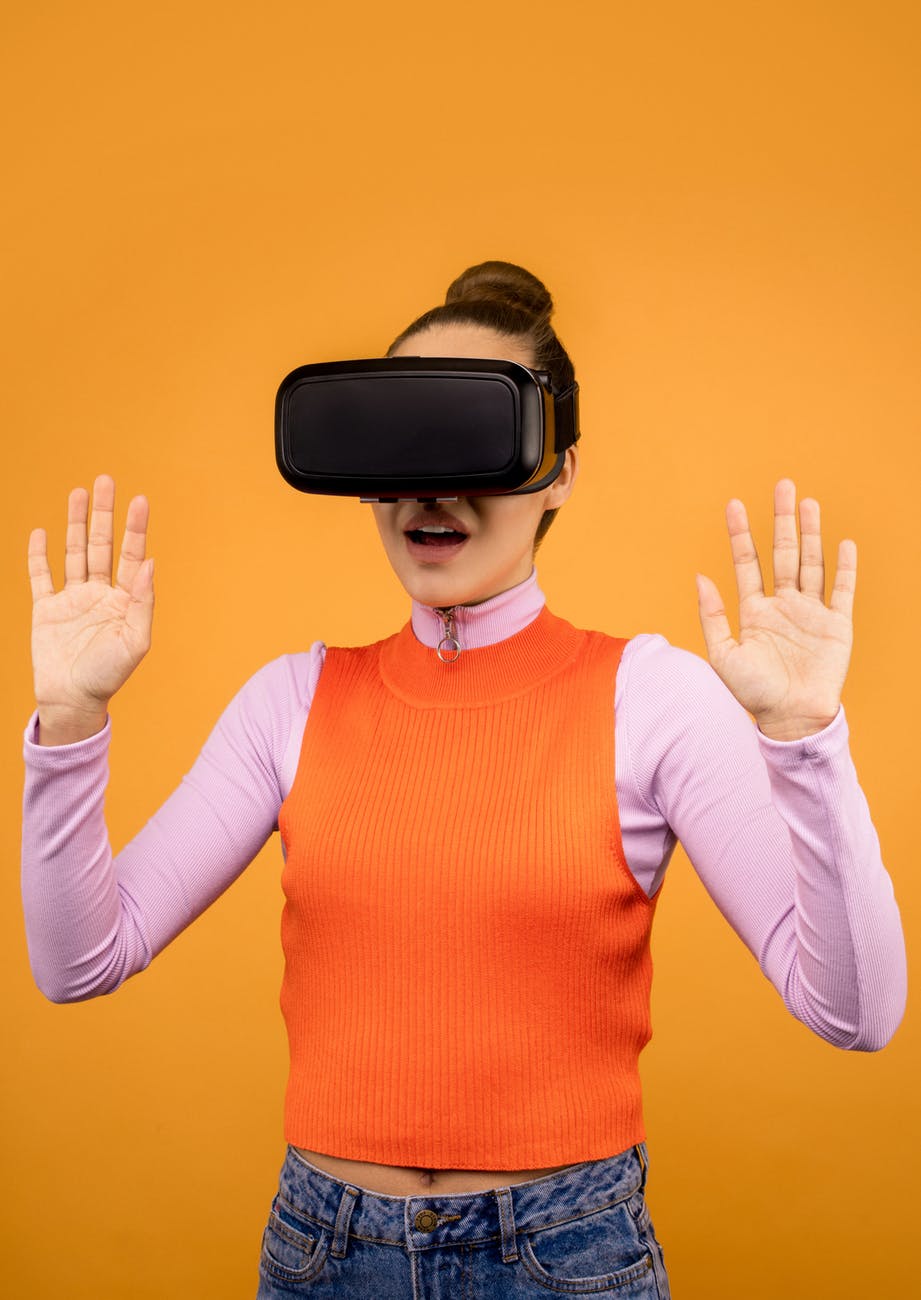 woman in long sleeve surprised by virtual reality